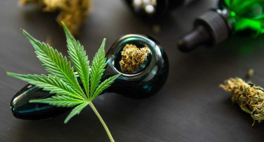 Marijuana Grinder Fresh Marihuana. Cannabis Buds Weed On Black W Blunt Wraps